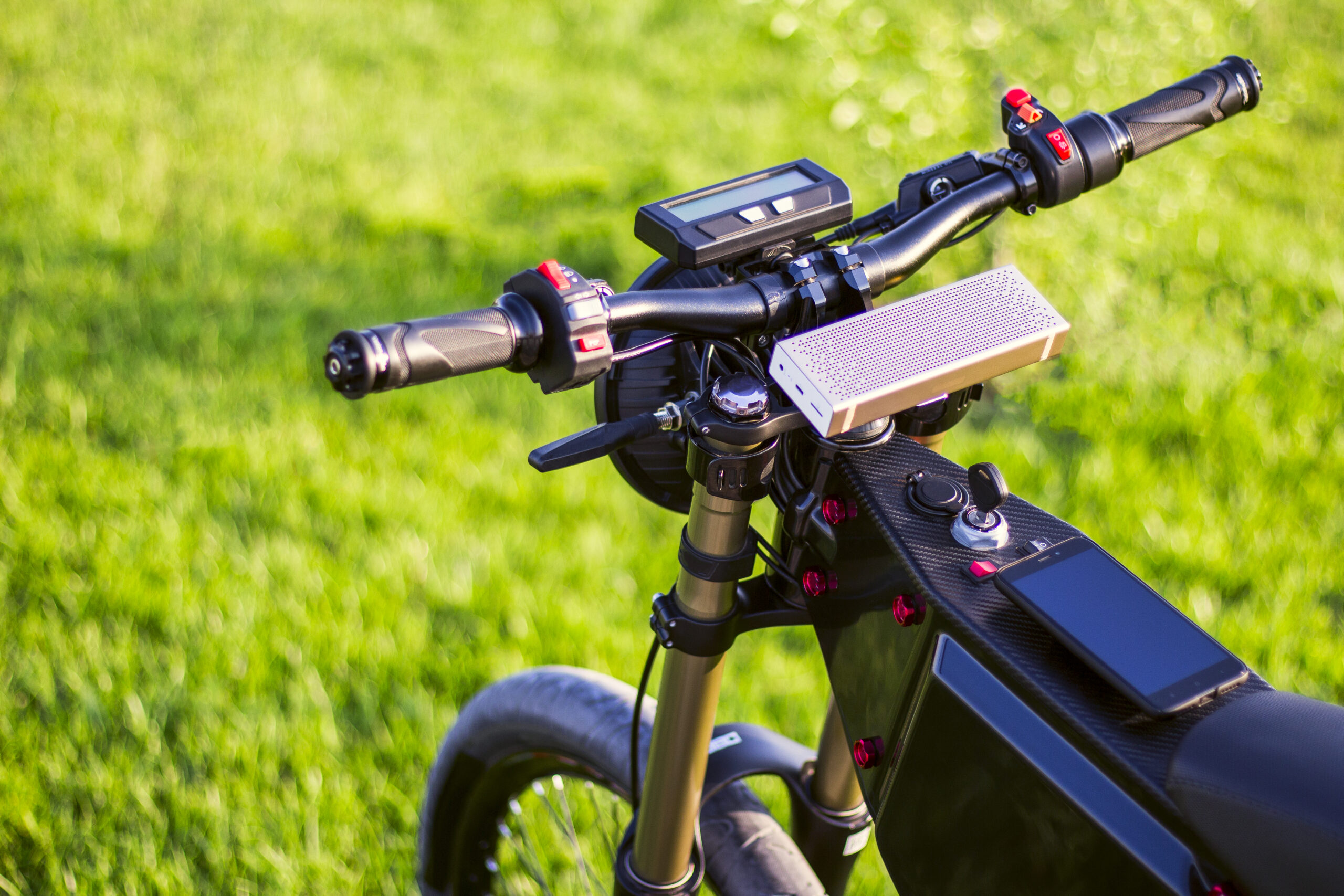 Steering wheel electric bike with monitor and suspension fork. Ebike bicycle environmentally friendly eco e-mountainbike transport. Healthy lifestyle